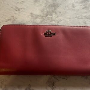 Maroon coach wallet.
